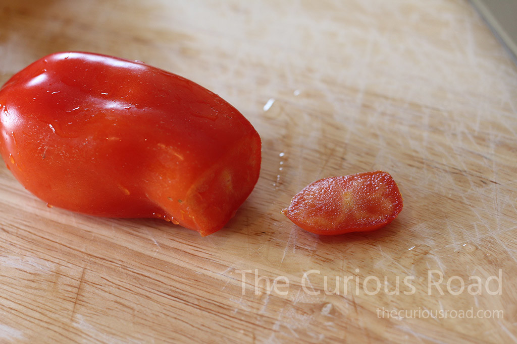 Cutting off the ends of San Marzano tomatoes makes the skins easy to remove