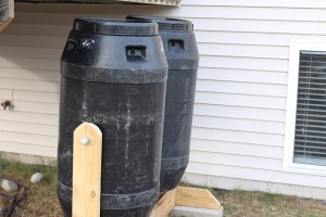 Side view of dual compost tumblers