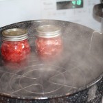 Filling the jars with strawberry jam