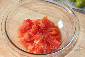 Place the blanched tomatoes into a mixing bowl